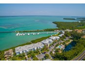 Aerial view of Marina Manor and Gasparilla Sound - Condo for sale at 5858 Gasparilla Rd #43, Boca Grande, FL 33921 - MLS Number is D6120934