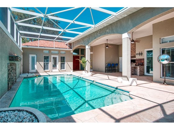 Eclosed/private yet open pool and lanai area with birdcage - Single Family Home for sale at 345 7th Ave N, Tierra Verde, FL 33715 - MLS Number is U8135988