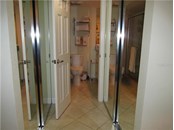 Master Bedroom closet and bathroom - Condo for sale at 1087 W Peppertree Dr #221d, Sarasota, FL 34242 - MLS Number is A4493593