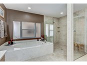 Master bath, jetted tub & Roman shower - Single Family Home for sale at 1518 Bel Air Star Pkwy, Sarasota, FL 34240 - MLS Number is A4506654