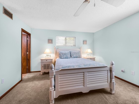 One of three spacious bedroom areas. - Condo for sale at 6810 Midnight Pass Rd, Sarasota, FL 34242 - MLS Number is A4507853