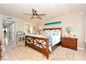 Master Bedroom, Closets to the left; ensuite bath to the right - Condo for sale at 450 Gulf Of Mexico Dr #B107, Longboat Key, FL 34228 - MLS Number is A4520786