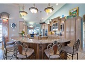 This amazing bar compliments this kitchen and allows guests to visit with the chef while preparing those special meals - Single Family Home for sale at 1012 Bayview Dr, Nokomis, FL 34275 - MLS Number is A4521028