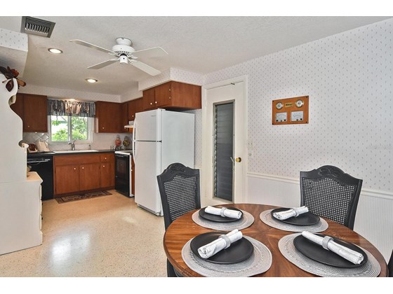 Dinette to kitchen - Single Family Home for sale at 19 Oakwood Dr N #19, Englewood, FL 34223 - MLS Number is N6118266